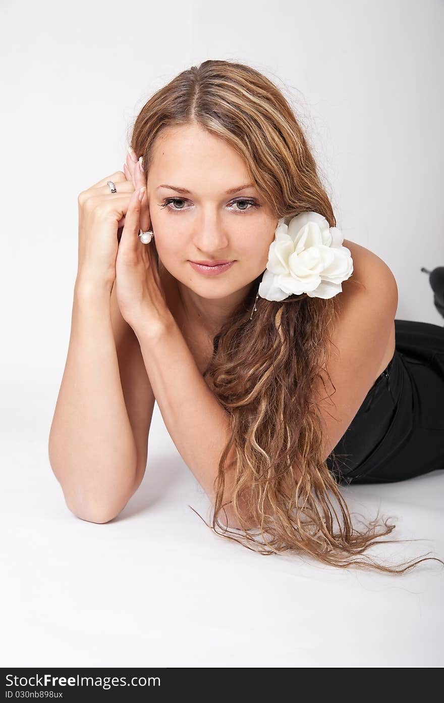 In the photo beautiful young girl on a gray background