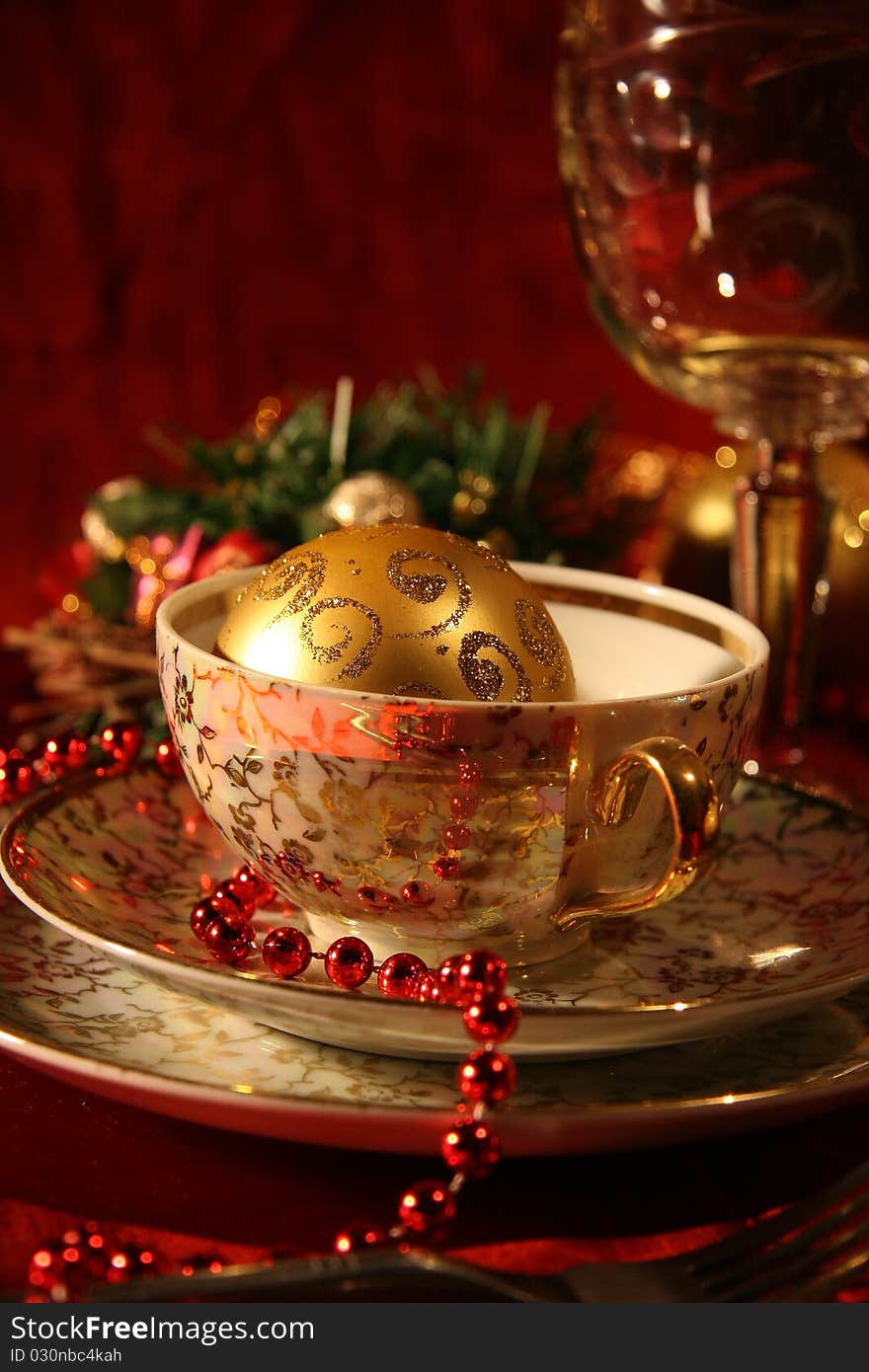 Table with gold dishes on red background. Table with gold dishes on red background