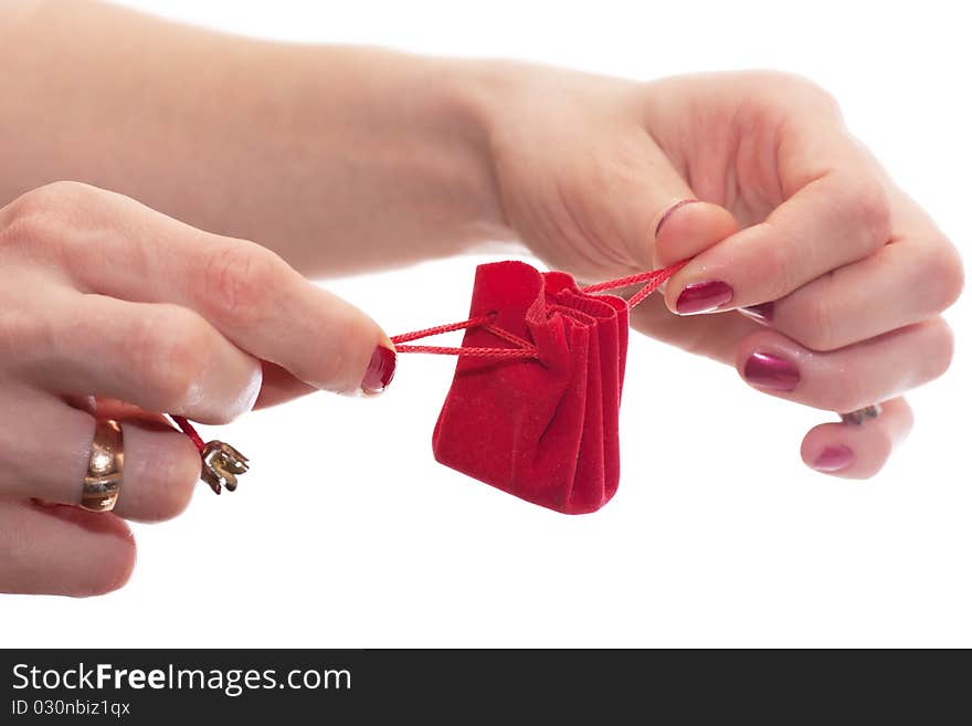 Woman stretching ribbons of gift wrapping