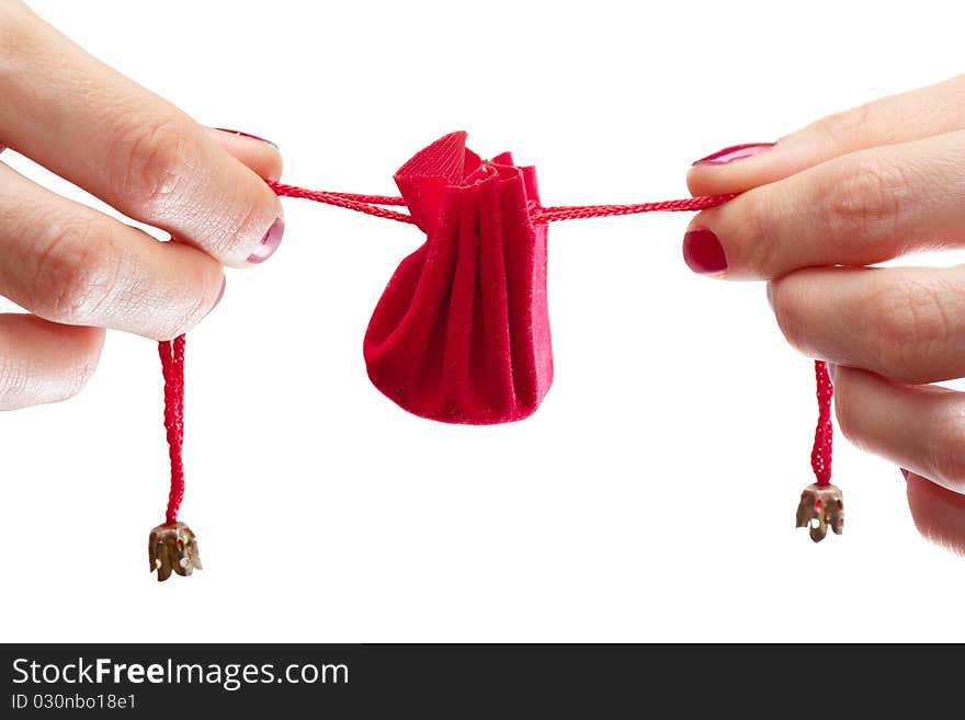 Woman stretching ribbons of gift wrapping