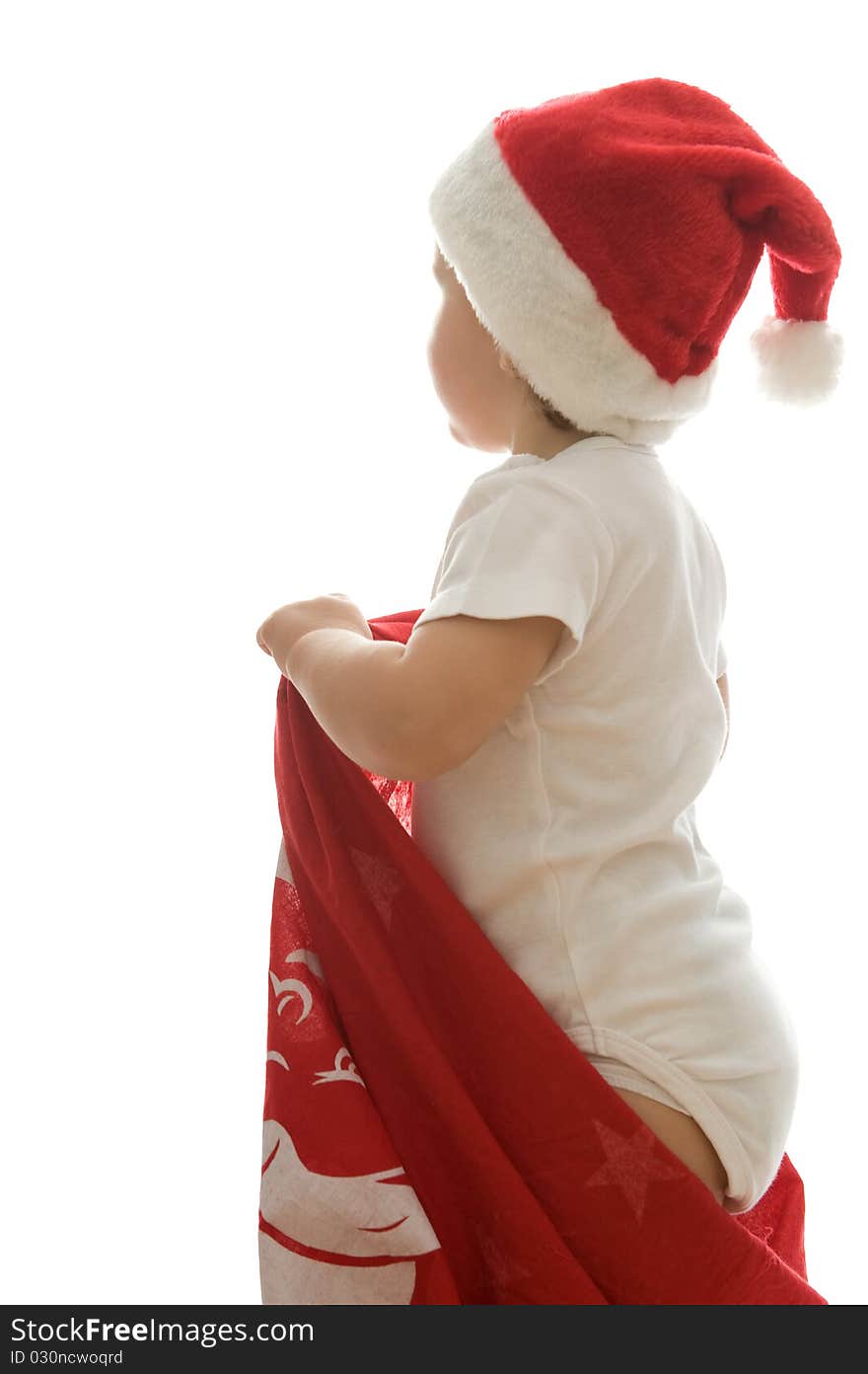 Little girl is waiting santa claus in his bag