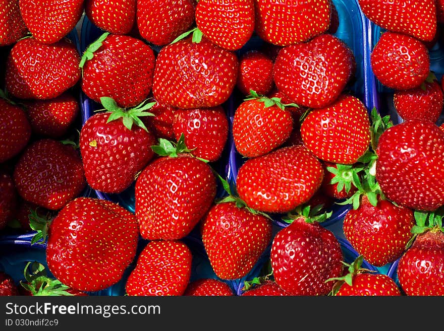 Landscape view of red strawberry background in the box in a market