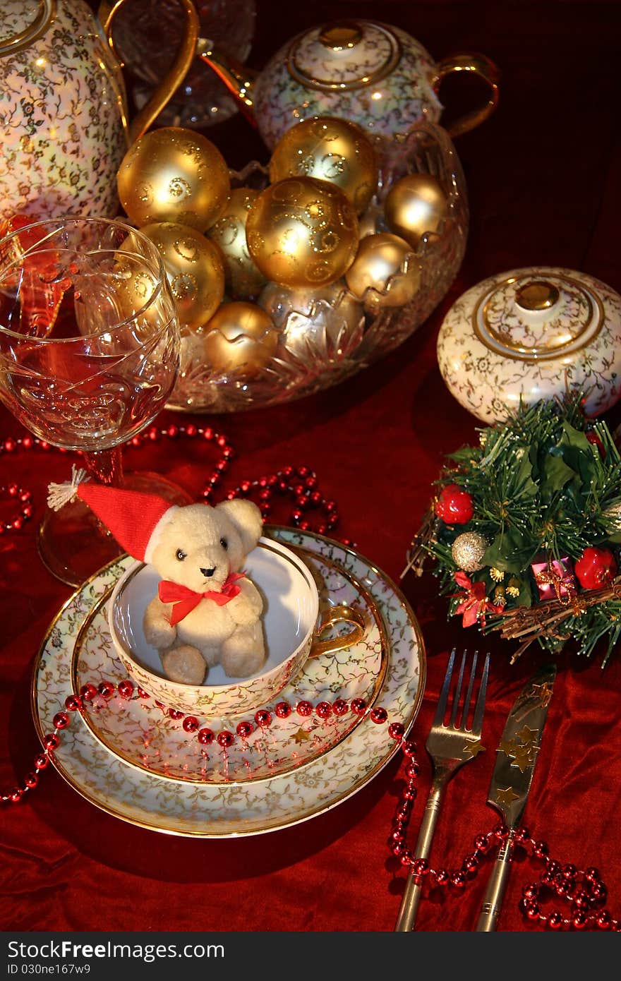 Table with gold dishes on red background. Table with gold dishes on red background