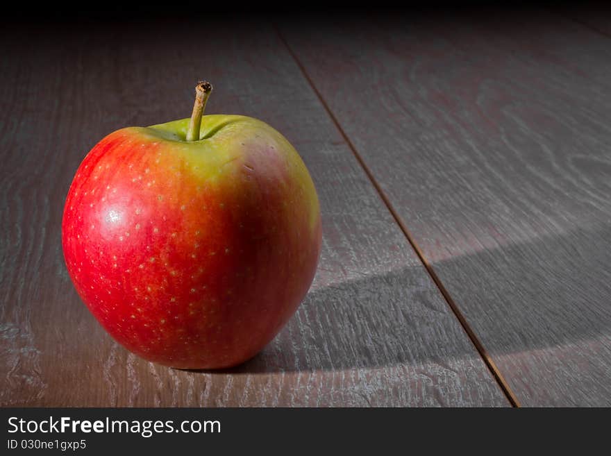 Apple On A Wooden Table