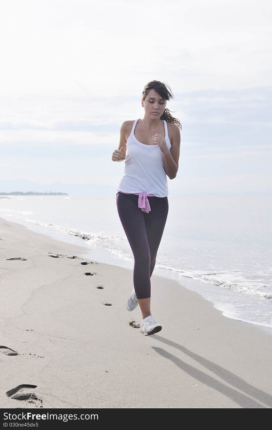 Woman running on beach