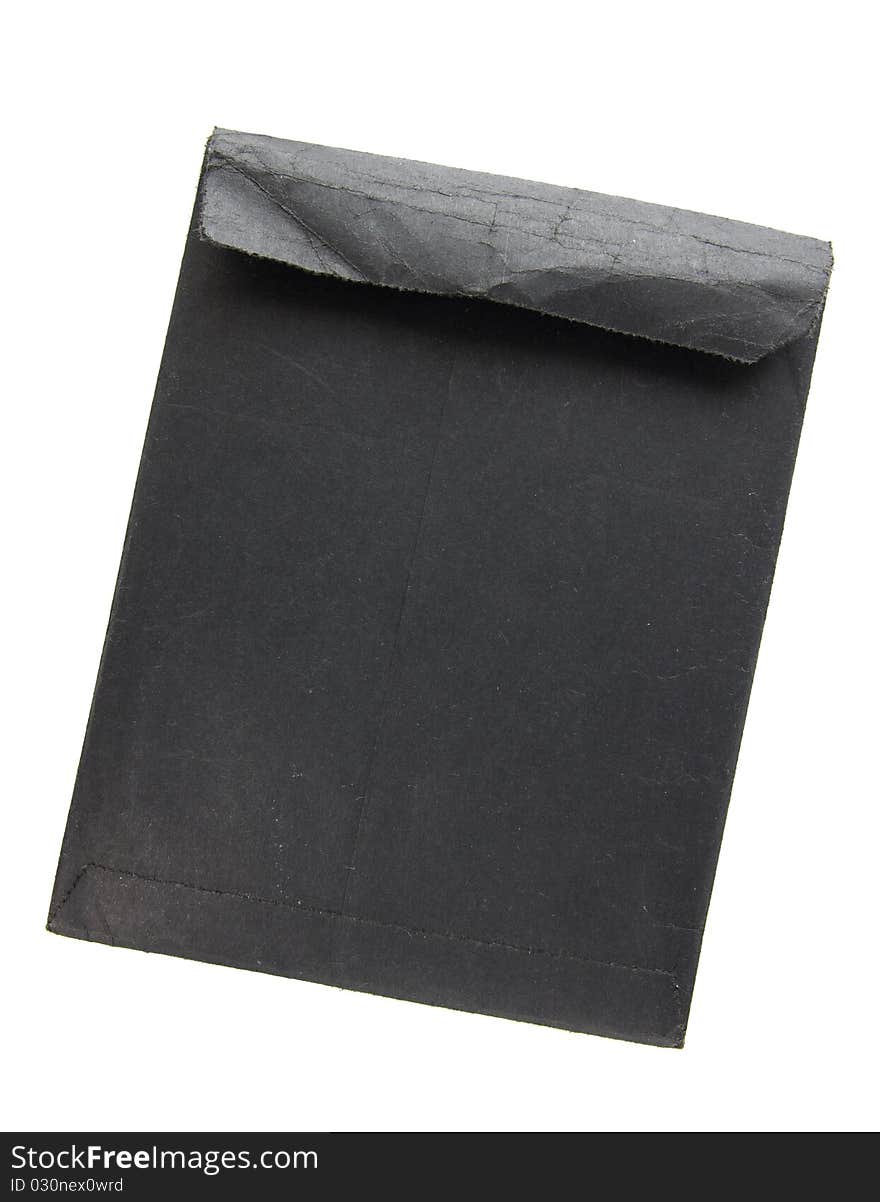 Old black envelope isolated on white