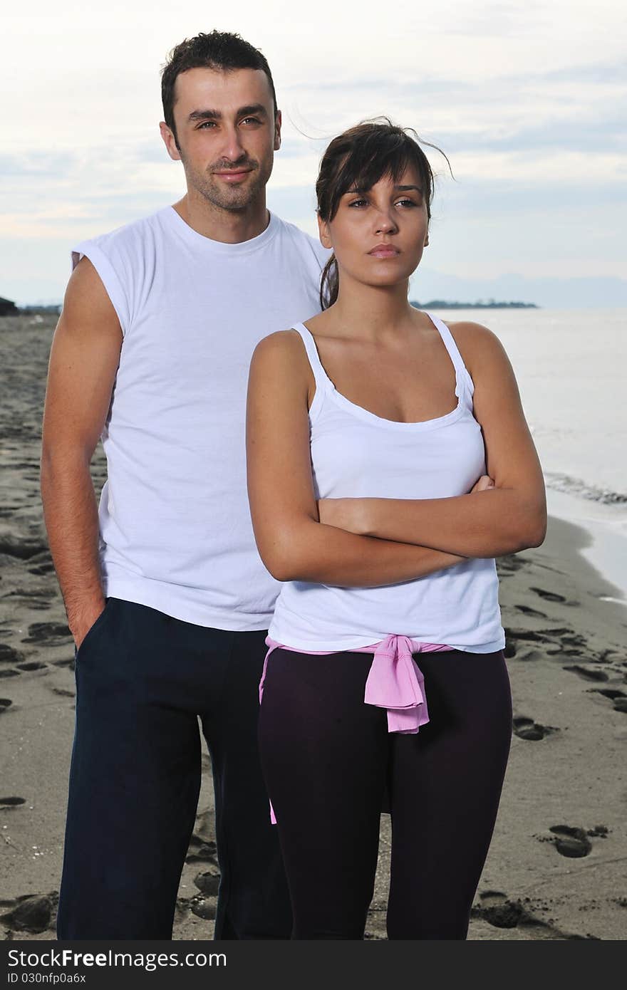 Happy young couple have fun at beautiful beach