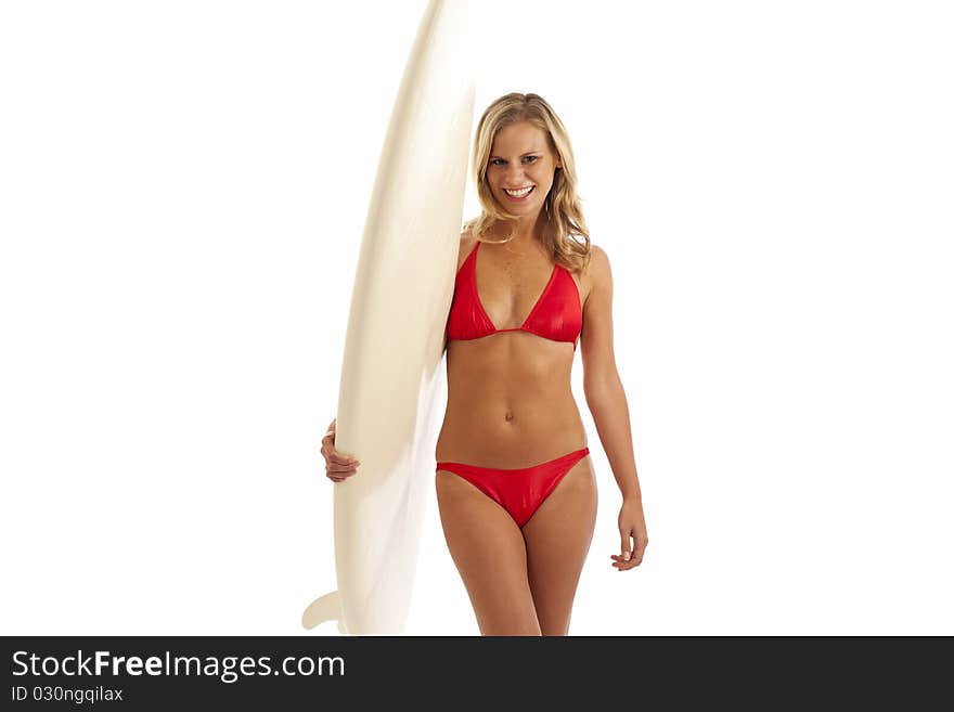 Cropped portrait of young woman holding surfboard. Cropped portrait of young woman holding surfboard