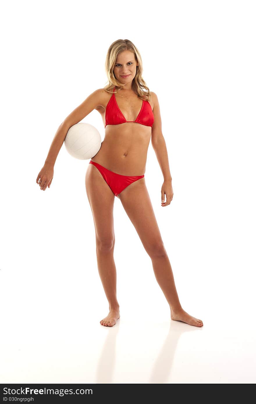 Portrait of young woman in red bikini holding volleyball. Portrait of young woman in red bikini holding volleyball