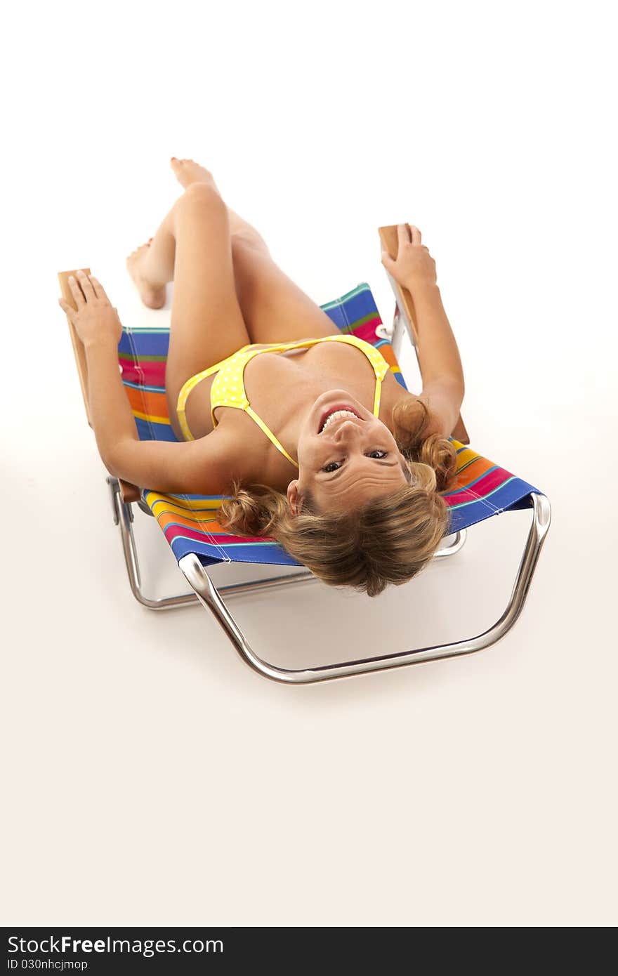 Young woman relaxing in beach chair