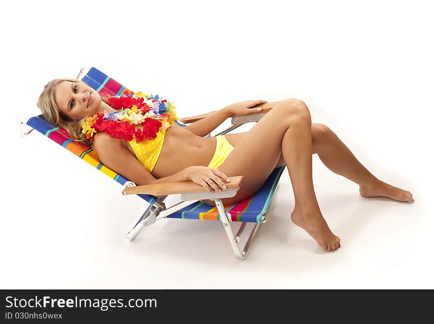 Young woman relaxing in beach chair