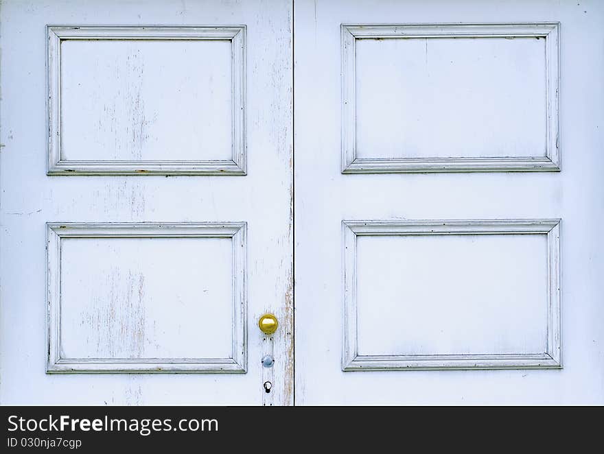 Old wooden door with brass knob