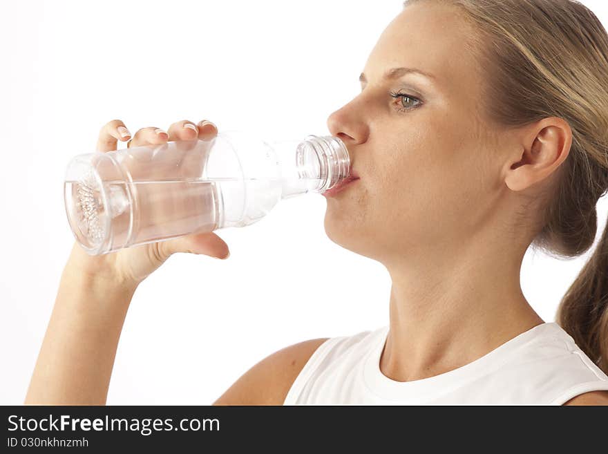 Young woman drinking bottled water