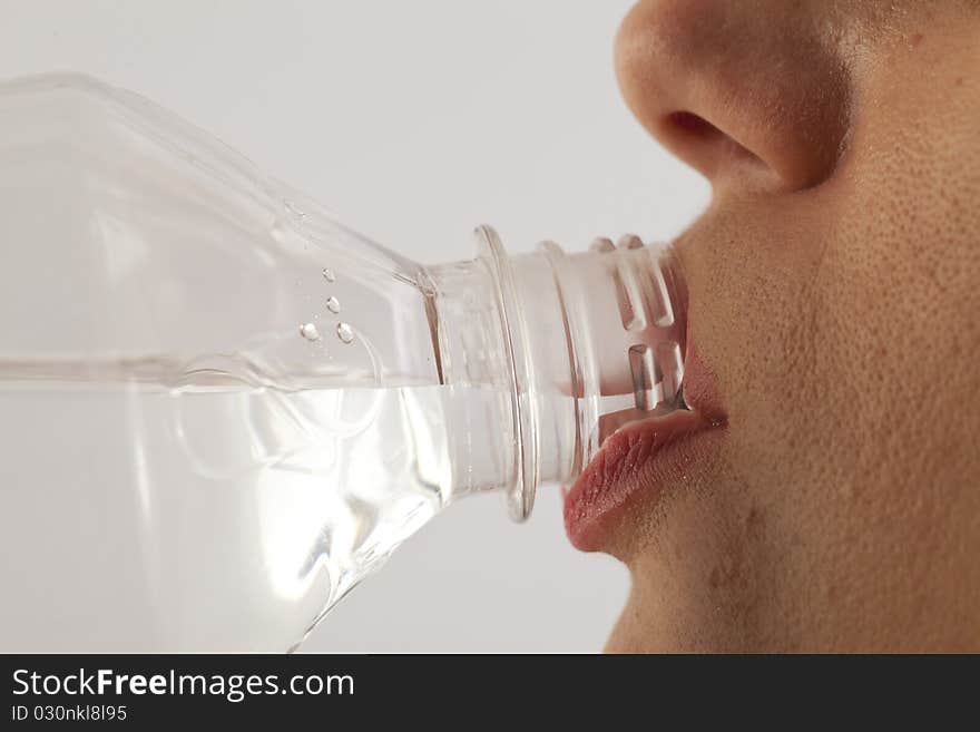 Young Woman Drinking Bottled Water