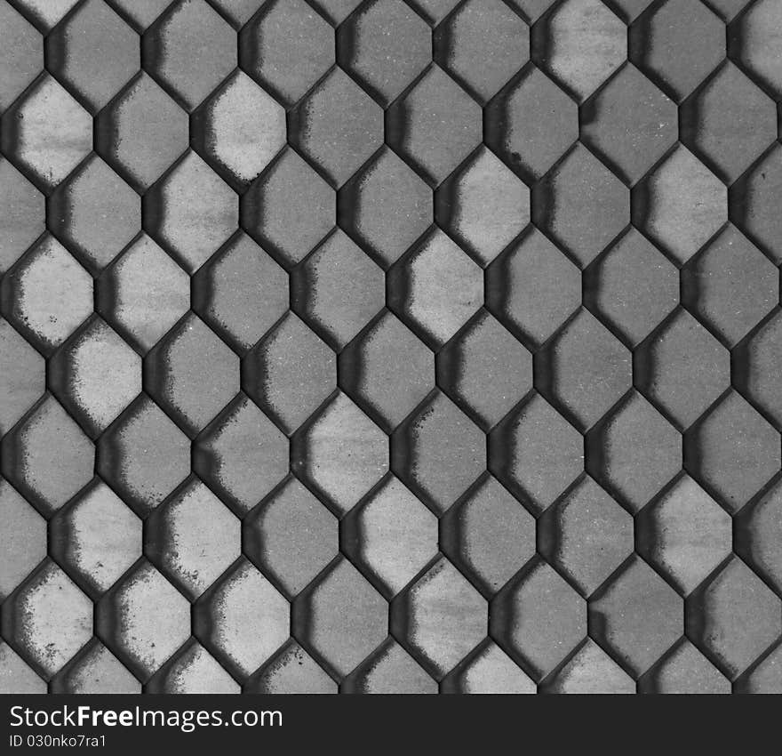 Hexagonal grey slate tiles set in a repeating pattern. Hexagonal grey slate tiles set in a repeating pattern