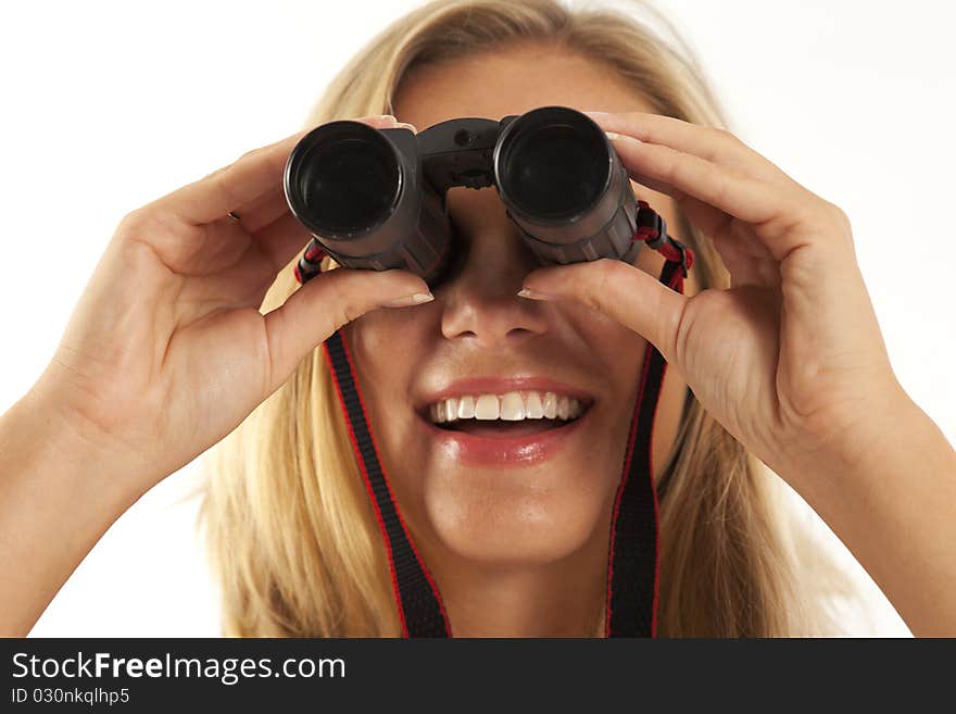 Close up of young woman looking through binoculars. Close up of young woman looking through binoculars