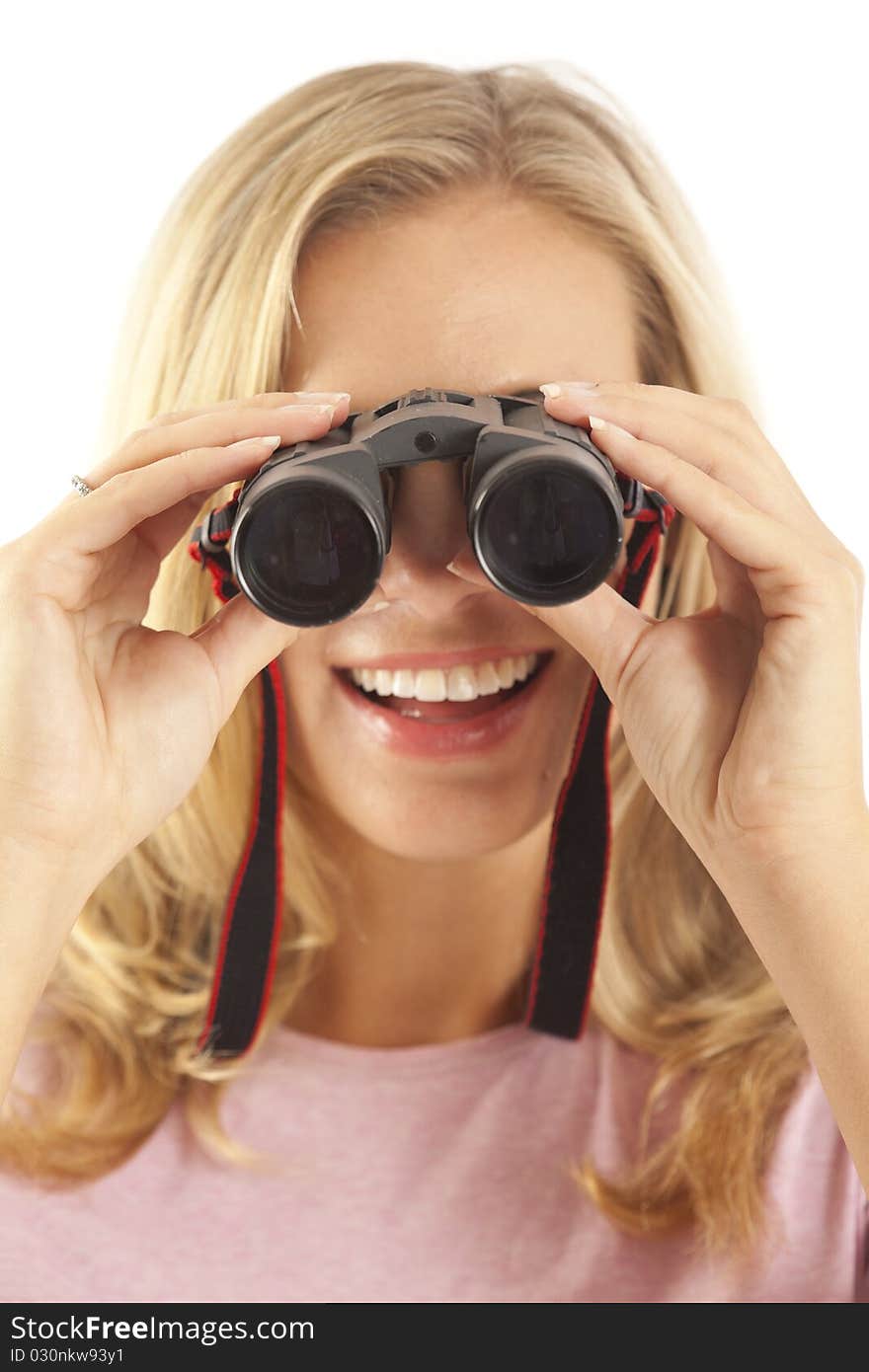 Young woman using binoculars