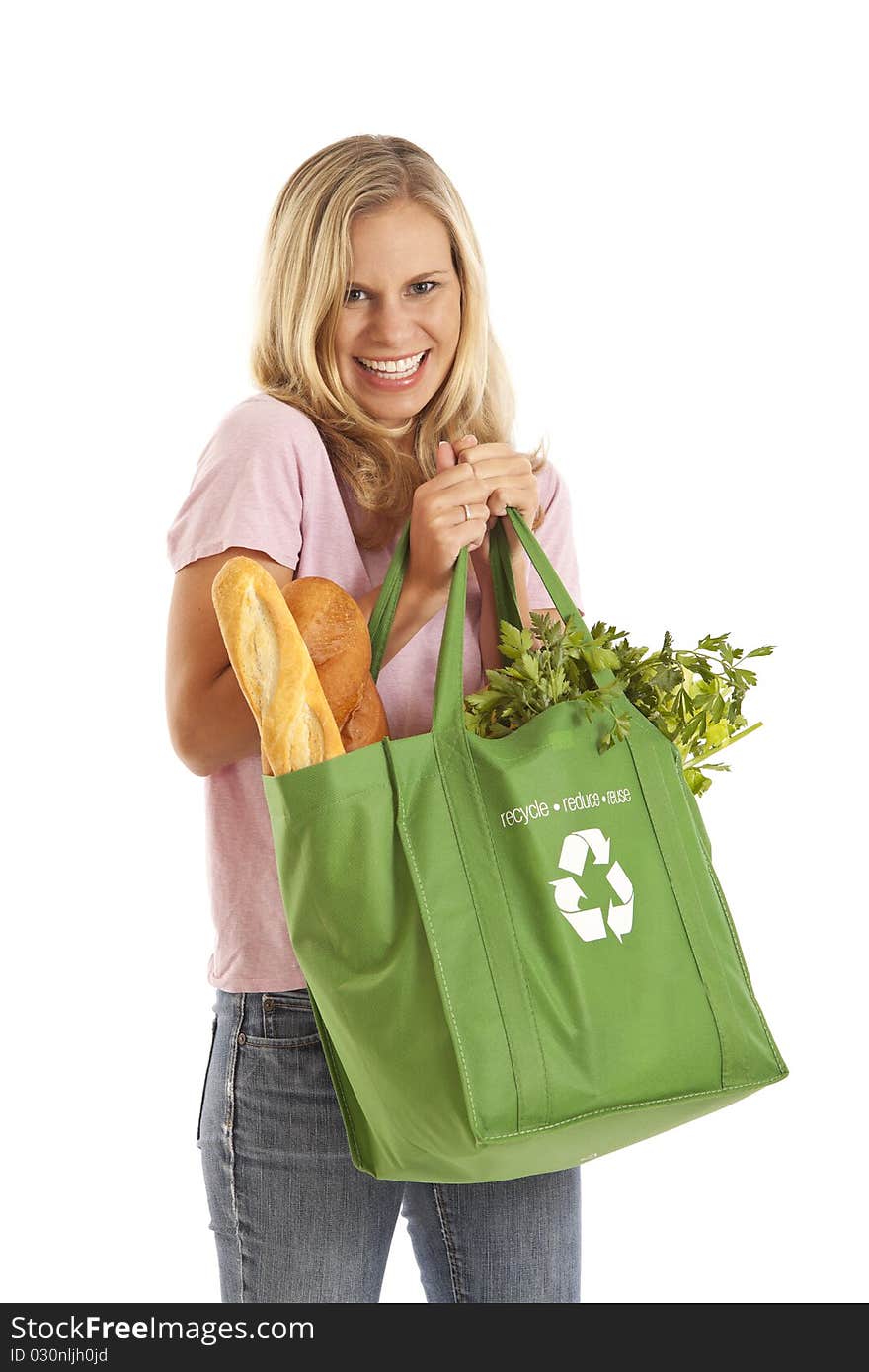 Young woman with groceries in recycle bag