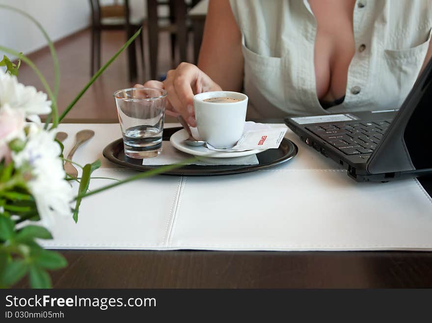 Woman with cup of espresso and laptop. Woman with cup of espresso and laptop