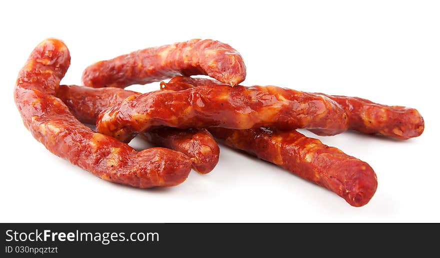 Smoked sausages isolated on white background. Smoked sausages isolated on white background