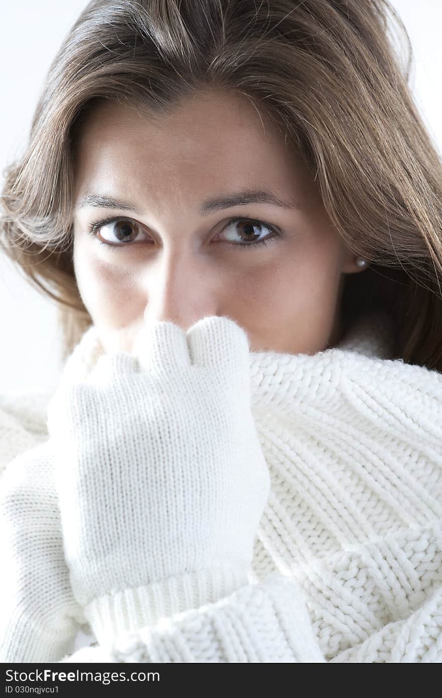 Portrait of a young woman in sof white sweater. Portrait of a young woman in sof white sweater