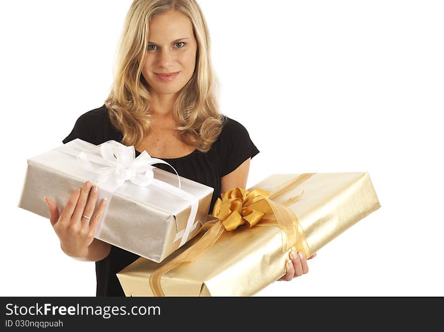 Young woman in black holding elegant gold and silver presents. Young woman in black holding elegant gold and silver presents