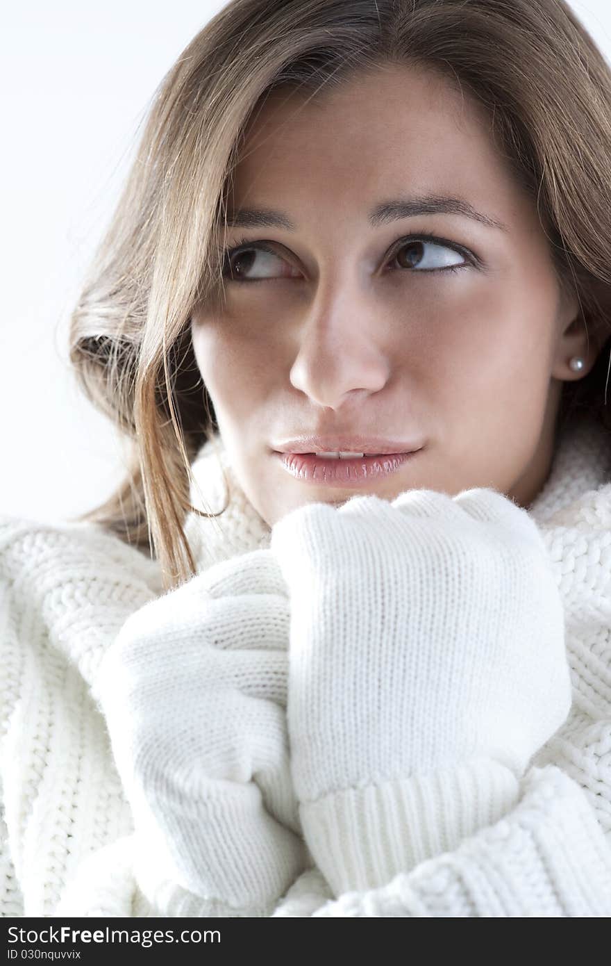 Portrait of a young woman in sof white sweater. Portrait of a young woman in sof white sweater