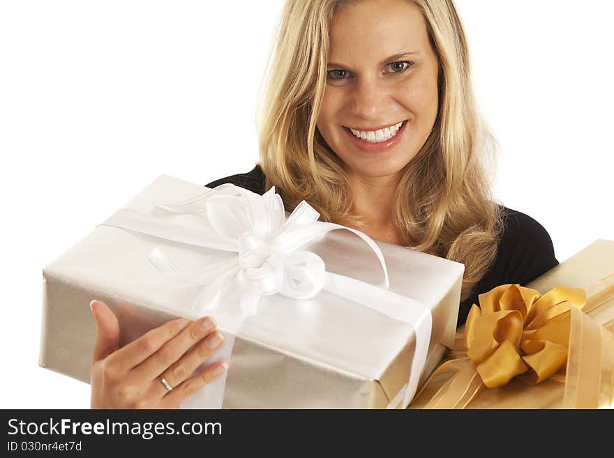 Young woman in black holding elegant gold and silver presents. Young woman in black holding elegant gold and silver presents