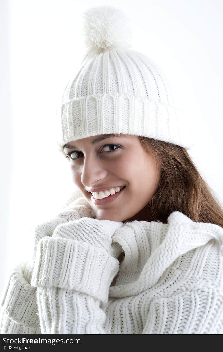 Portrait of a young woman in sof white sweater. Portrait of a young woman in sof white sweater