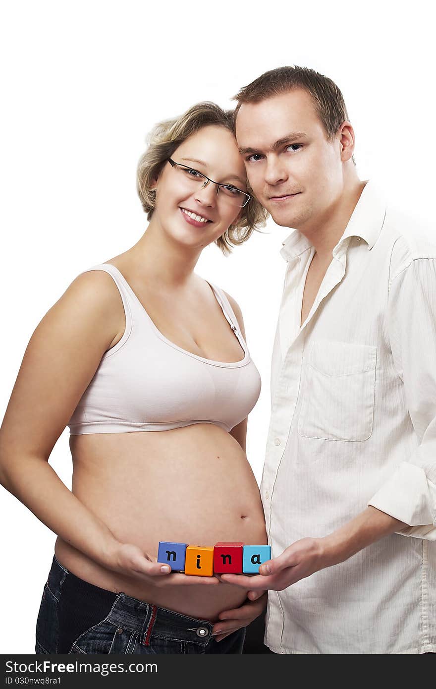 Happy smiling couple posing for pregnancy photographs. Happy smiling couple posing for pregnancy photographs