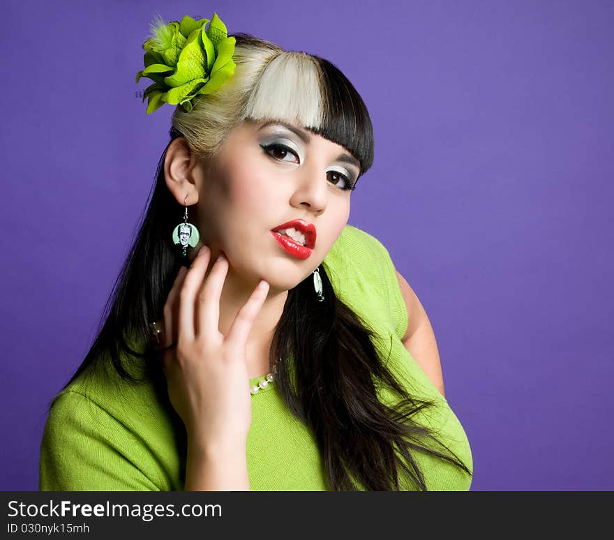 Asian girl wearing green sweater and green hair flower. Asian girl wearing green sweater and green hair flower