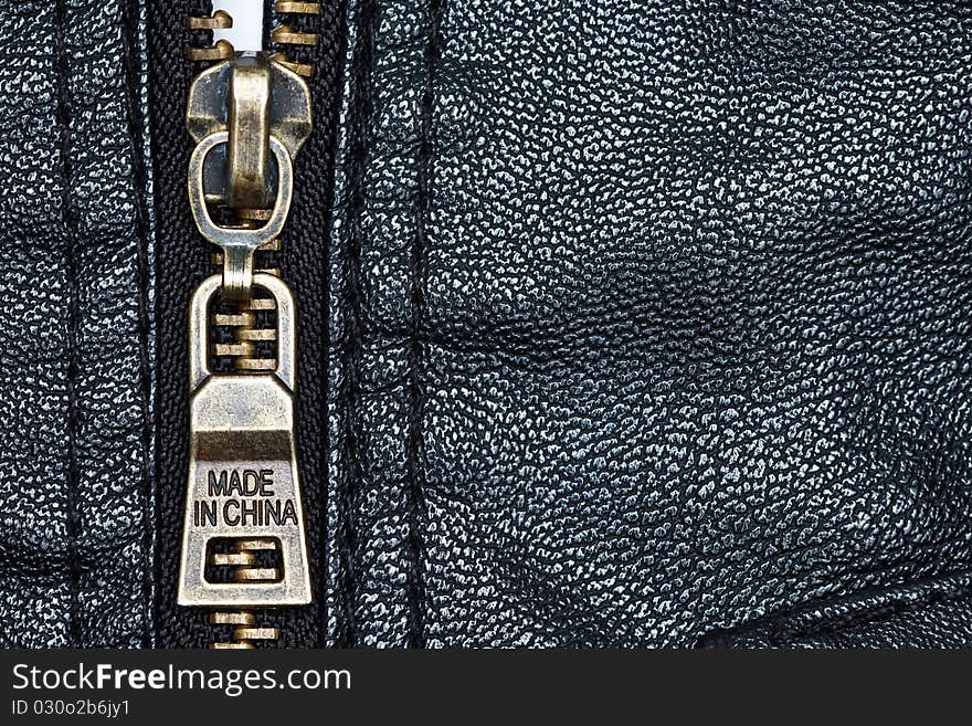 Metal zip and texture of artificial leather. Metal zip and texture of artificial leather