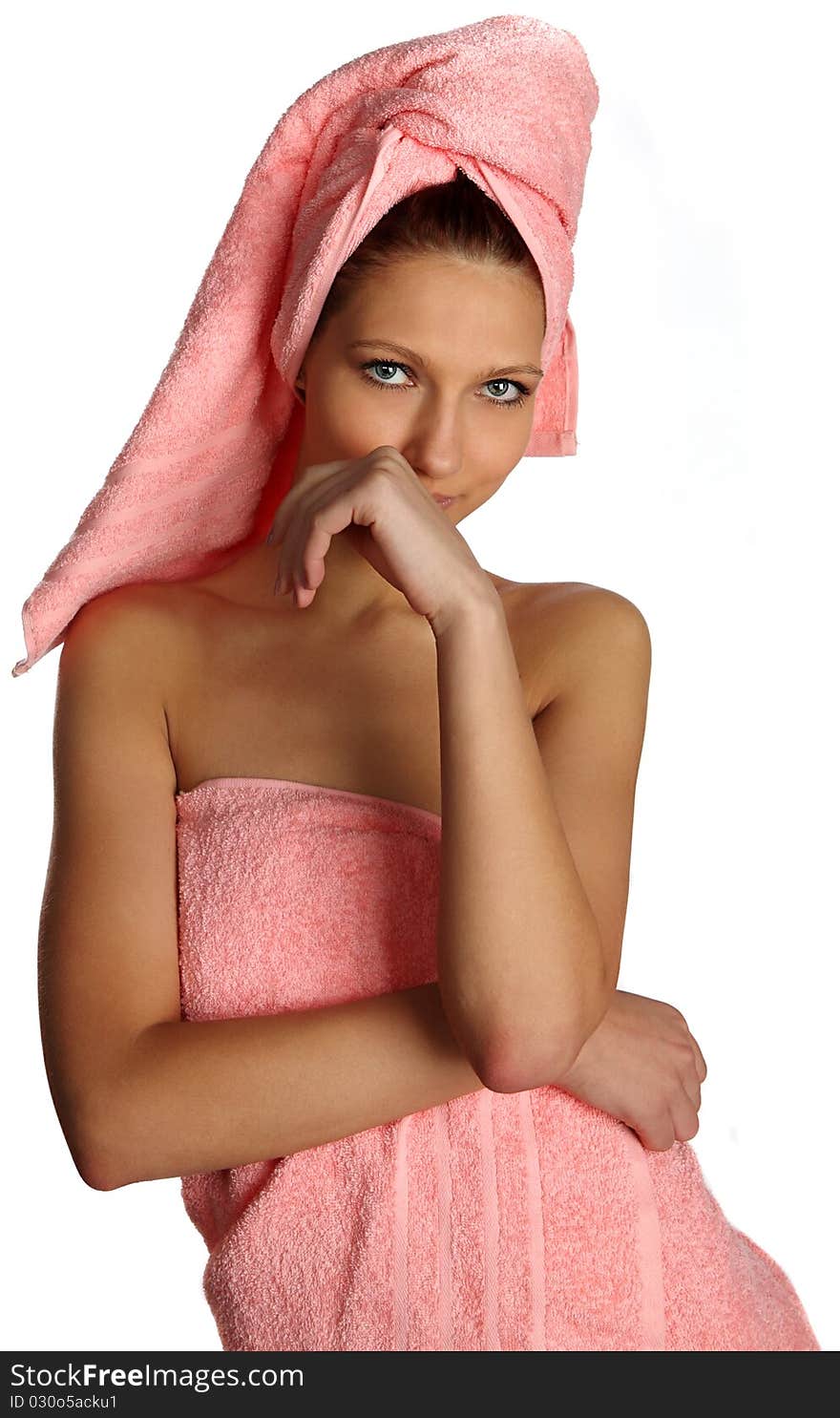 Relaxed clean woman with towel on head after spa salon