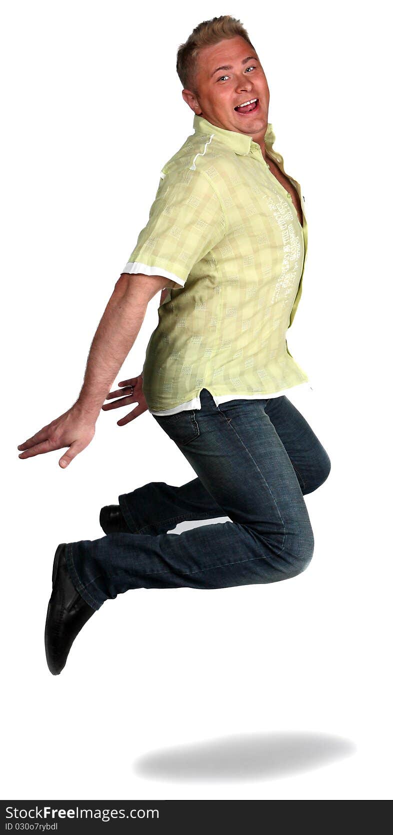 Adult man jumping in the studio and smiling. Adult man jumping in the studio and smiling