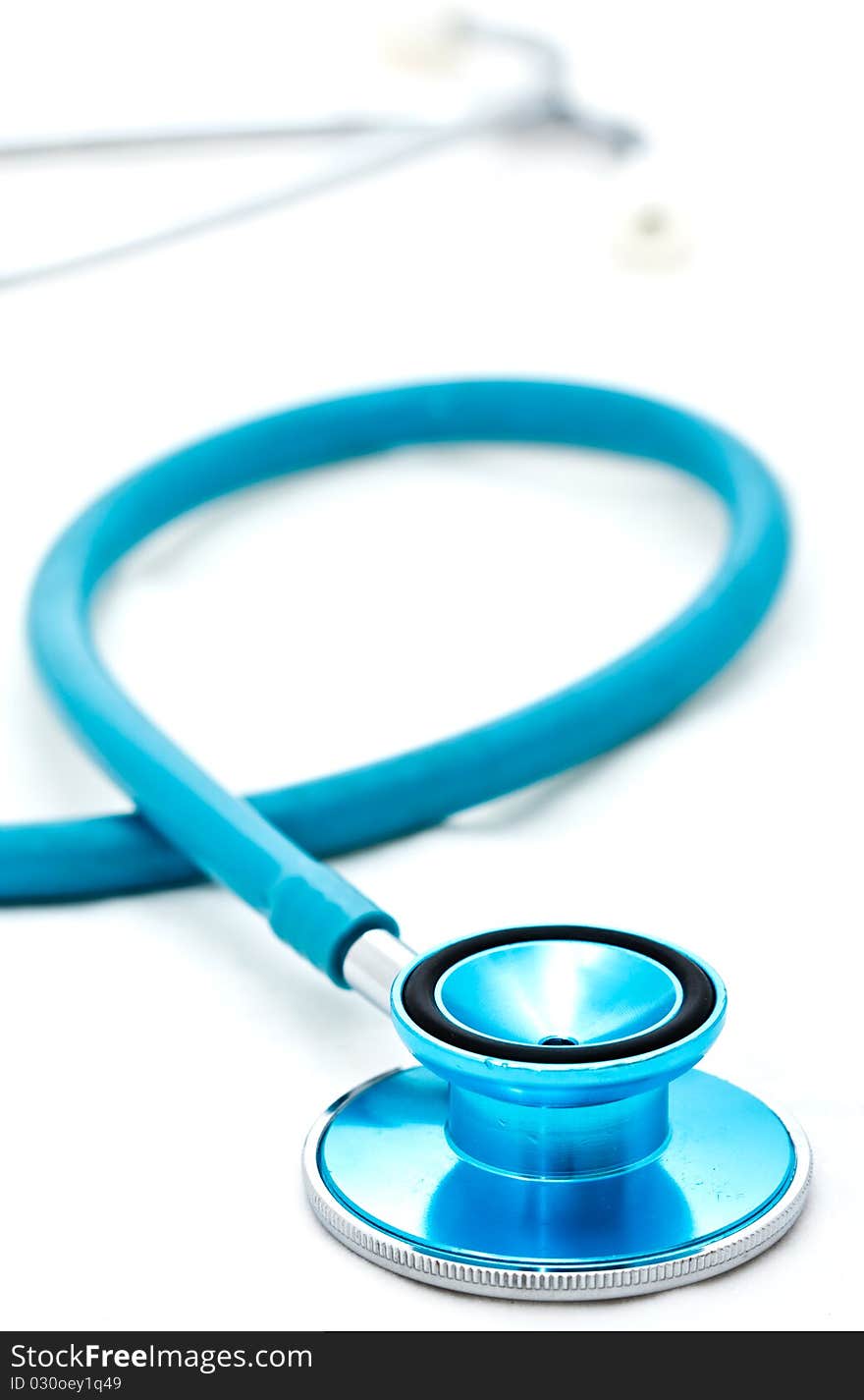 Blue stethoscope placed on white background