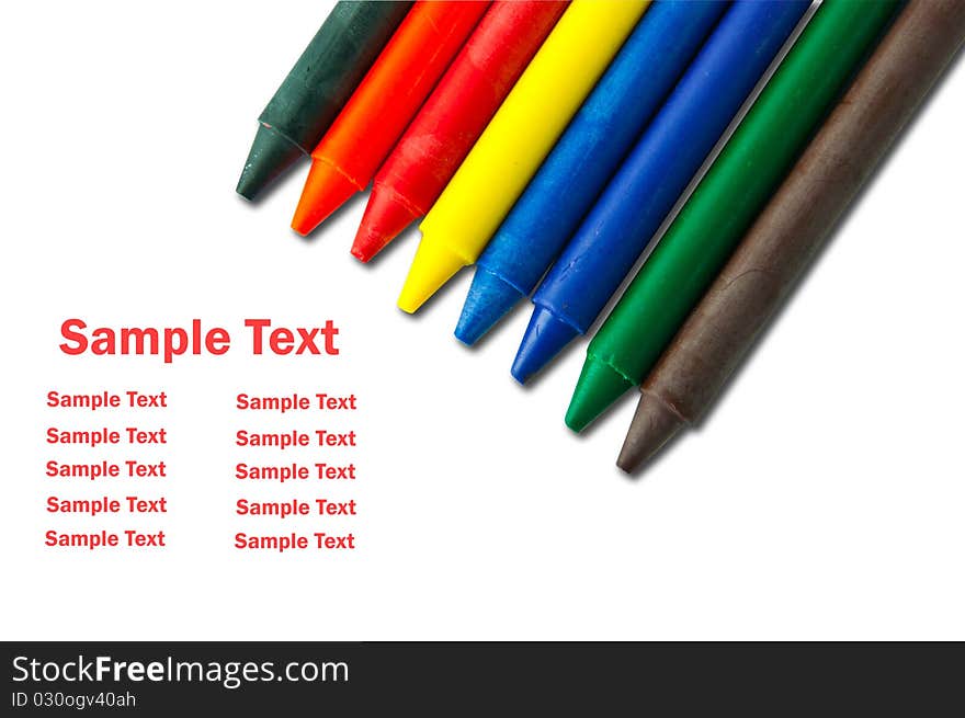 Colorful crayons on white with sample text