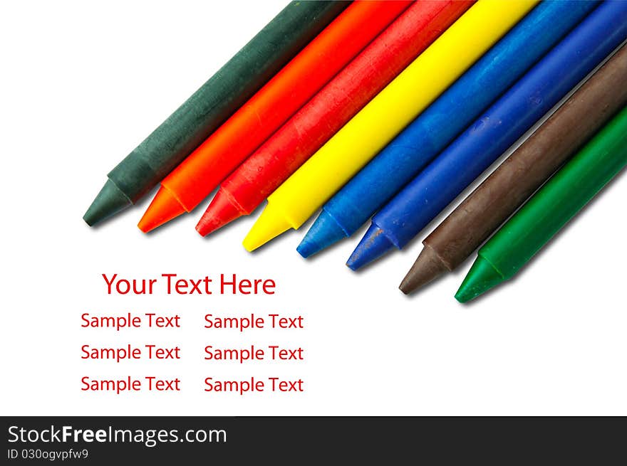 Colorful crayons on white with sample text