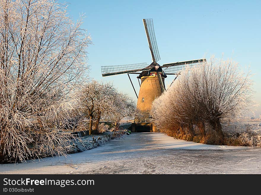 Mill in winter landscape