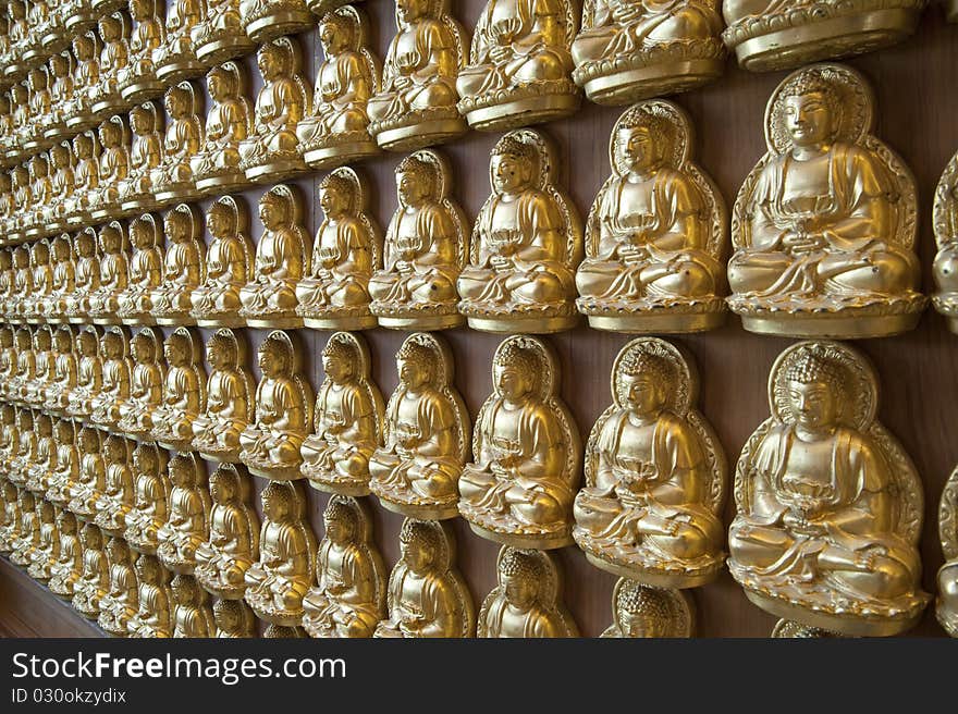 Buddha statue on the wall in Chinese Temple