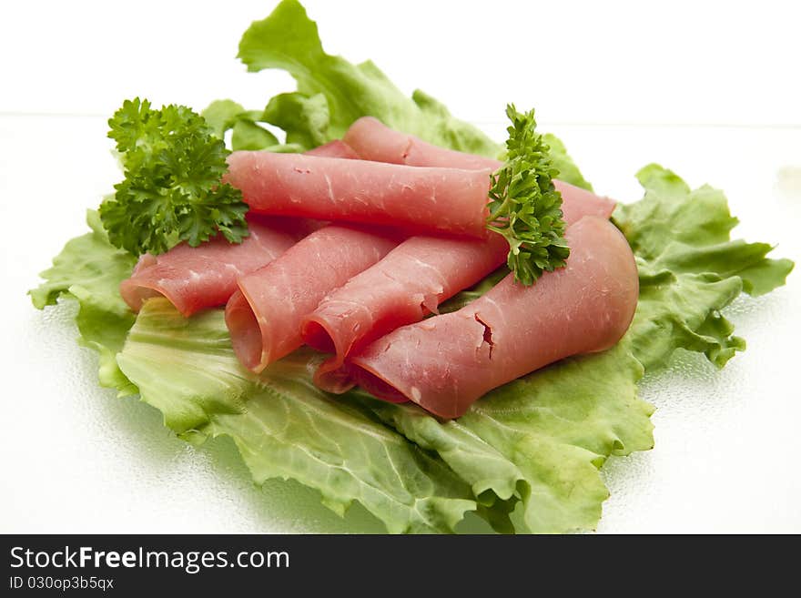 Laughing-ham onto lettuce leaves and with parsley. Laughing-ham onto lettuce leaves and with parsley