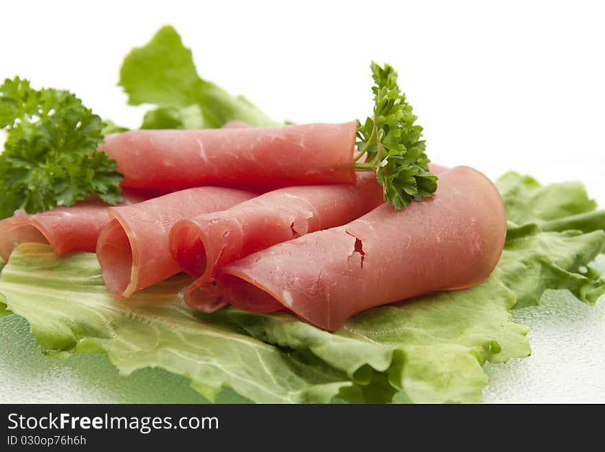 Nut ham onto lettuce leaves and with parsley