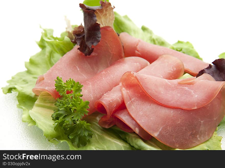 Nut ham onto lettuce leaves and with parsley