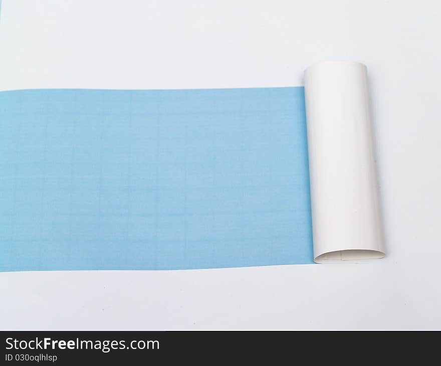 Blue background visible through the white paper wrapped