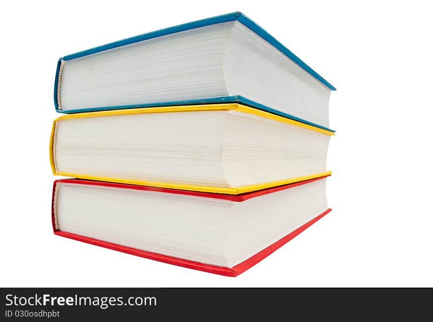 Horizontal stack of three books isolated on white background.wide angle. Horizontal stack of three books isolated on white background.wide angle.