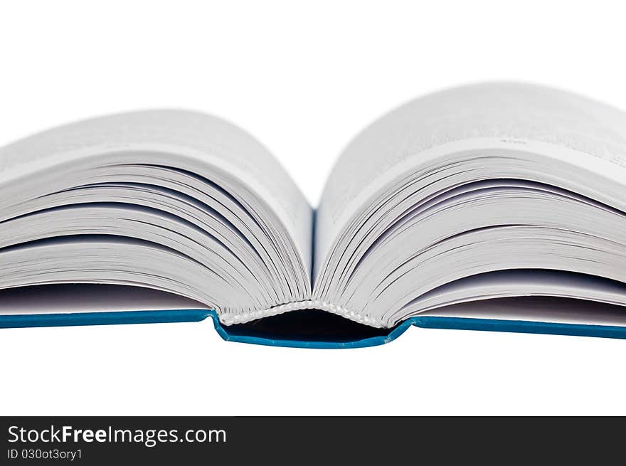 Closeup shot of opened book isolated on white background. macro.