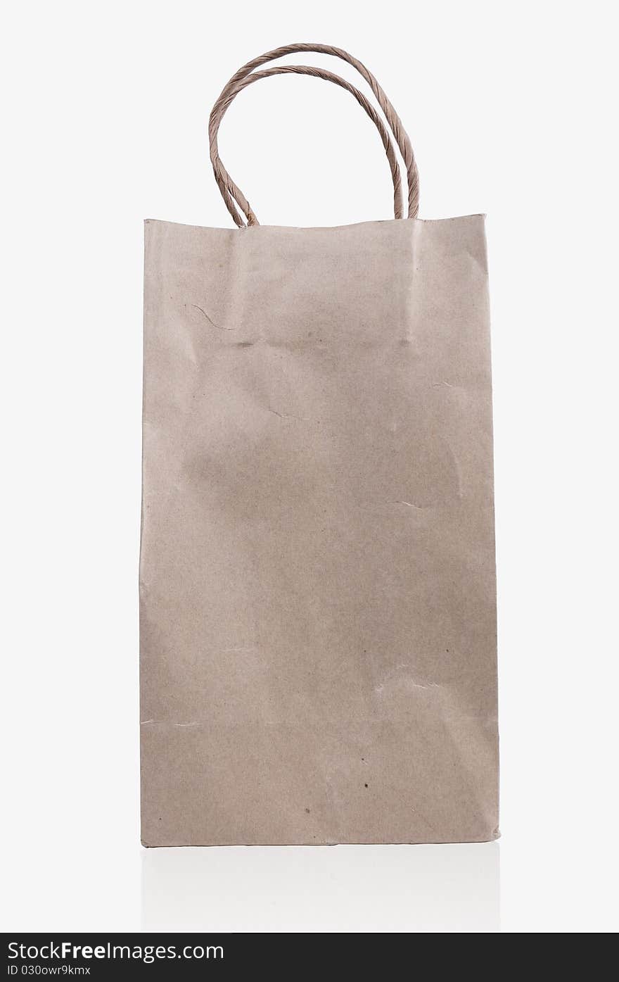 Brown paper bag on white background