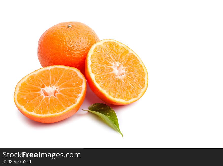 Ripe tangerines with leaves and slices