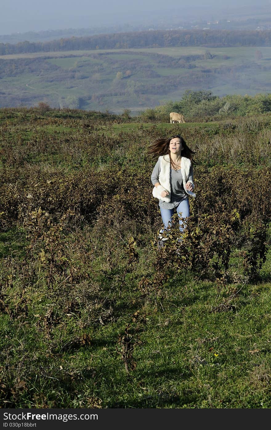 Happy teenager with hair flying  having fun in nature. Happy teenager with hair flying  having fun in nature