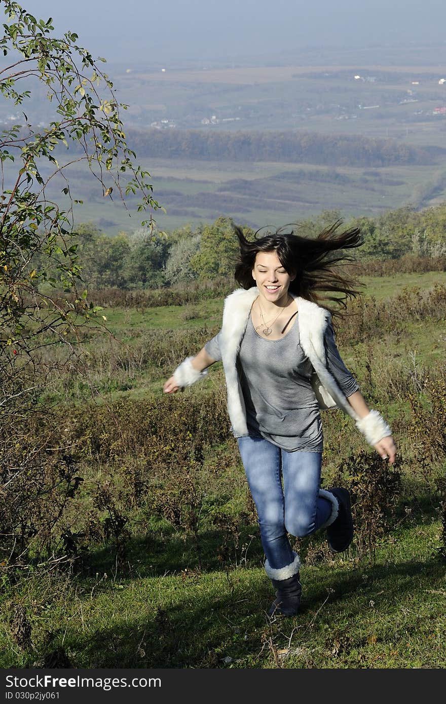 Happy teenager with hair flying  having fun in nature. Happy teenager with hair flying  having fun in nature