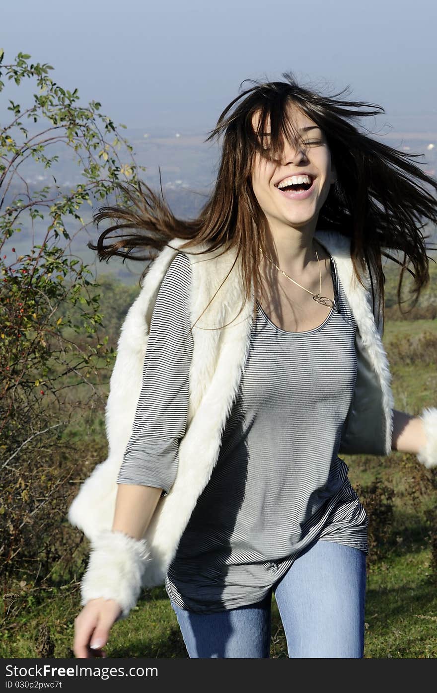 Happy teenager with hair flying having fun in nature. Happy teenager with hair flying having fun in nature